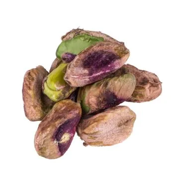 Peeled pistachios without shell close up isolated on white background Stock Photos