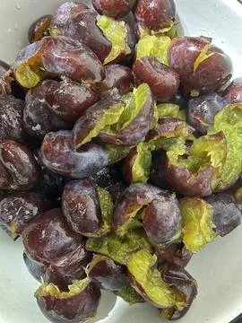 Peeled plums Stock Photos