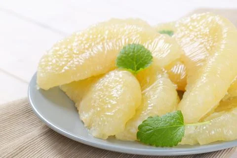 Peeled pomelo segments Stock Photos