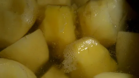 Peeled potato is being boiled Stock Footage 252856747
