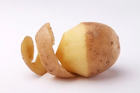 Peeled potato isolated on a white background Stock Photos
