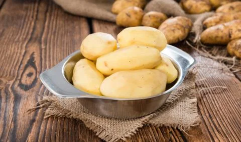 Peeled potatoes Stock Photos