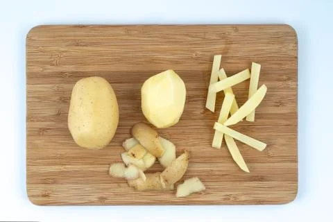 Peeled potatoes Stock Photos