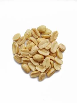 Peeled roasted peanuts on a white background Stock Photos