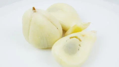 Peeled Salak Snake Fruit Rotating on White Background Stock Footage 325347318