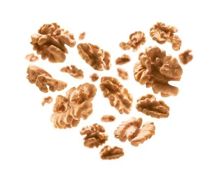 Peeled from the shell, walnut kernels in the shape of a heart Stockfoto's