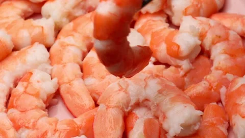 Peeled shrimp rotating in circle with fresh pink and white texture Stock Footage 310785666