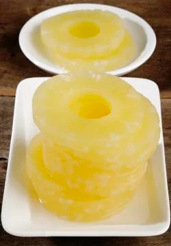 Peeled slices of pineapple Stock Photos
