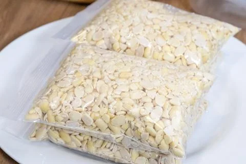 Peeled split soybeans packed tightly in a clear plastic zipper pouch, prese.. Stock Photos
