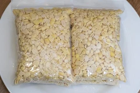 Peeled split soybeans packed tightly in a clear plastic zipper pouch, prese.. Stock Photos