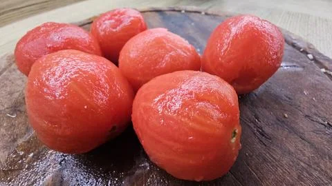 Peeled tomatoes Stock Photos