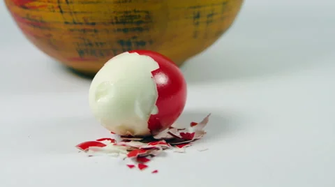 Peeled Traditional Red Easter Egg Near A Bowl Stock Footage 60070228