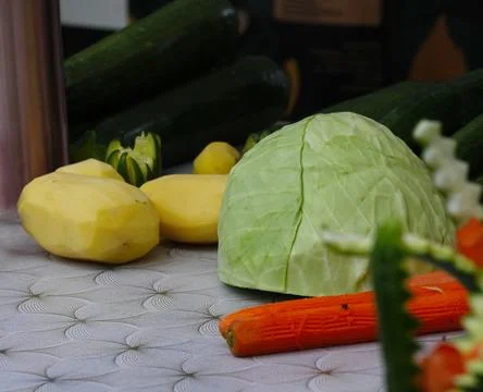 Peeled various vegetables on the table in close-up. Stock Photos