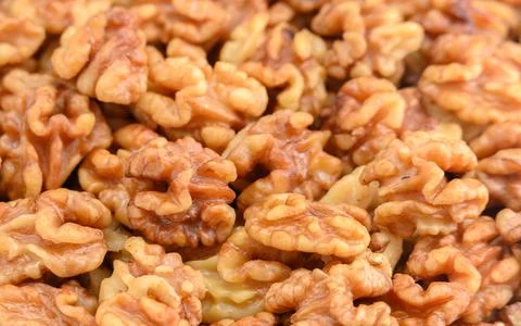 Peeled walnuts background macro strong focus full Stock Photos