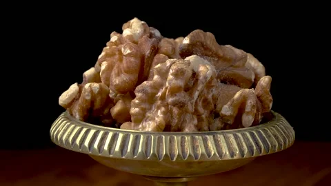 Peeled walnuts close-up on a black background Stock Footage 159651447