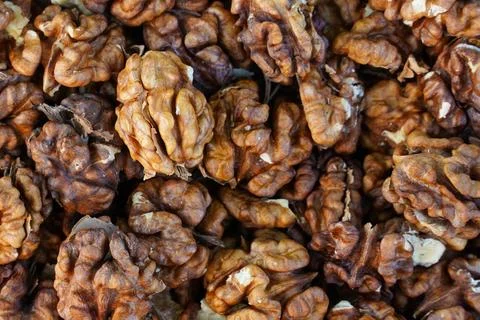 Peeled walnuts close-up. walnuts pattern. Stock Photos