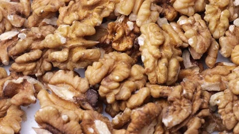 Peeled walnuts rotate close-up. fresh walnuts on the table Stock Footage 219824599