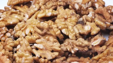 Peeled walnuts rotate close-up. fresh walnuts on the table Stock Footage 220317620