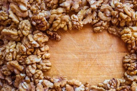 Peeled walnuts on the table. Stock Photos