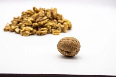 Peeled walnuts on white background Stock Photos
