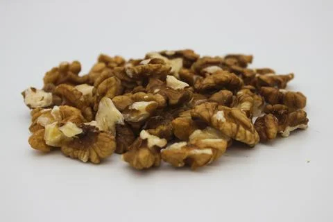 Peeled walnuts on white background Stock Photos