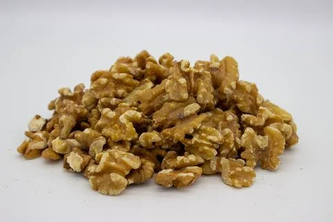 Peeled walnuts on white background Stock Photos