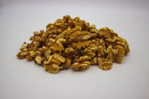 Peeled walnuts on white background Stock Photos