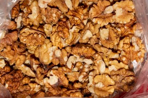 Peeled walnuts.Background of walnuts. Stock Photos