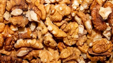 Peeled walnuts.Background of walnuts. Stock Photos