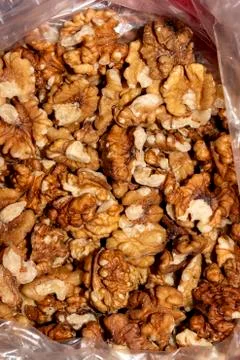 Peeled walnuts.Background of walnuts. Stock Photos