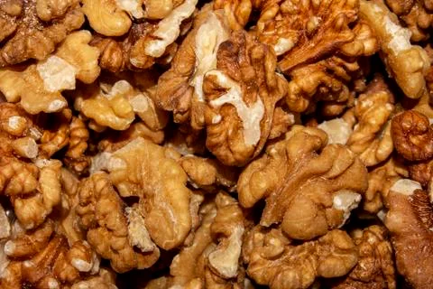 Peeled walnuts.Background of walnuts. Stock Photos