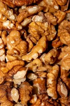 Peeled walnuts.Background of walnuts. Stock Photos