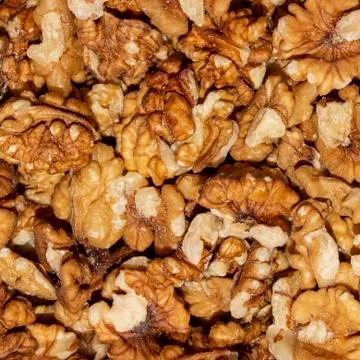 Peeled walnuts.Background of walnuts. Stock Photos
