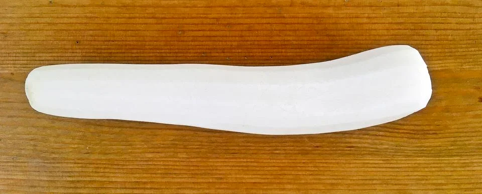 Peeled white radish on wooden table, preparing for making soup Stock Photos