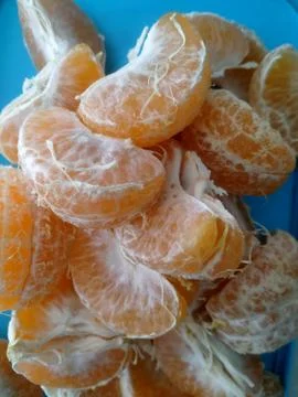 Peeled yellow oranges Stock Photos