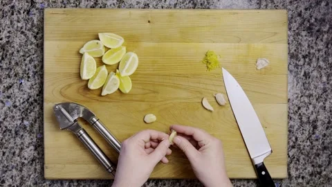 Peeling and crushing garlic Stock Footage 318545547