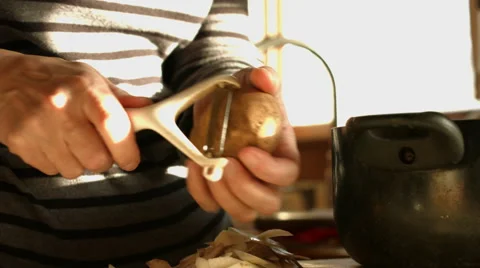 Peeling and Cutting a Potato Stock Footage 58631200
