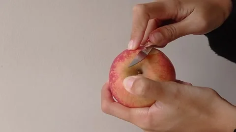 Peeling the apple with the peeler Stock Footage 150399282