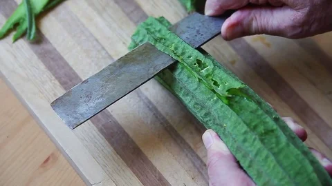 Peeling Asian silk squash Video stock 77811391