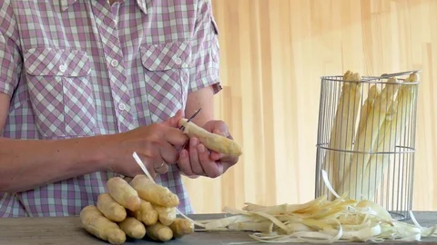 Peeling asparagus Stock Footage 75863309
