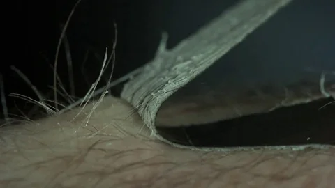 Peeling Off a Bandaid Macro 2 Video stock 77783079