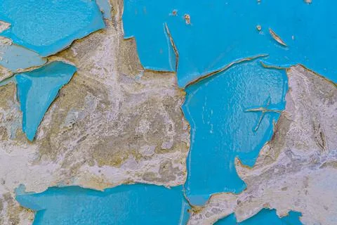 Peeling blue paint on wall texture Stock Photos