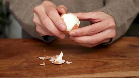 Peeling Boiled Egg Medium Shot Video stock 169153611