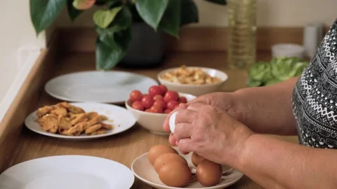 Peeling boiled egg for preparing Caesar salad Stock Footage 328372985