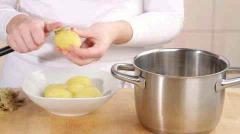 Peeling boiled potatoes Stock Footage 24655133