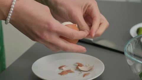 Peeling Brown Egg in Kitchen Cooking Close-Up Hands Stock-Footage 341416525