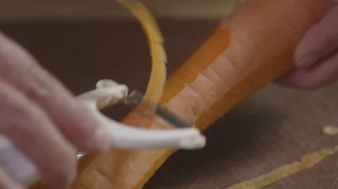 Peeling a carrot; close-up Stock Footage 64024802