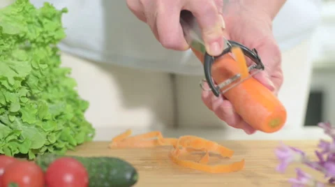 Peeling carrots, closeup Stock Footage 47609104