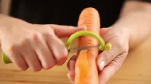 Peeling carrots by hand Stock Footage 56481013