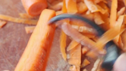 Peeling carrots point of view Stock Footage 102747424